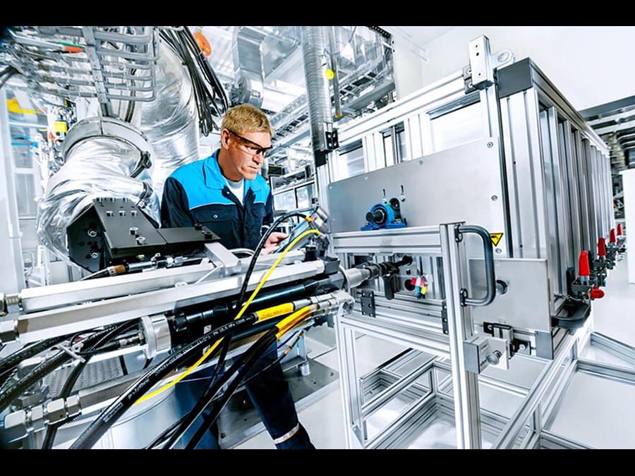 An employee working on a machine at the Polyurethane technical center.