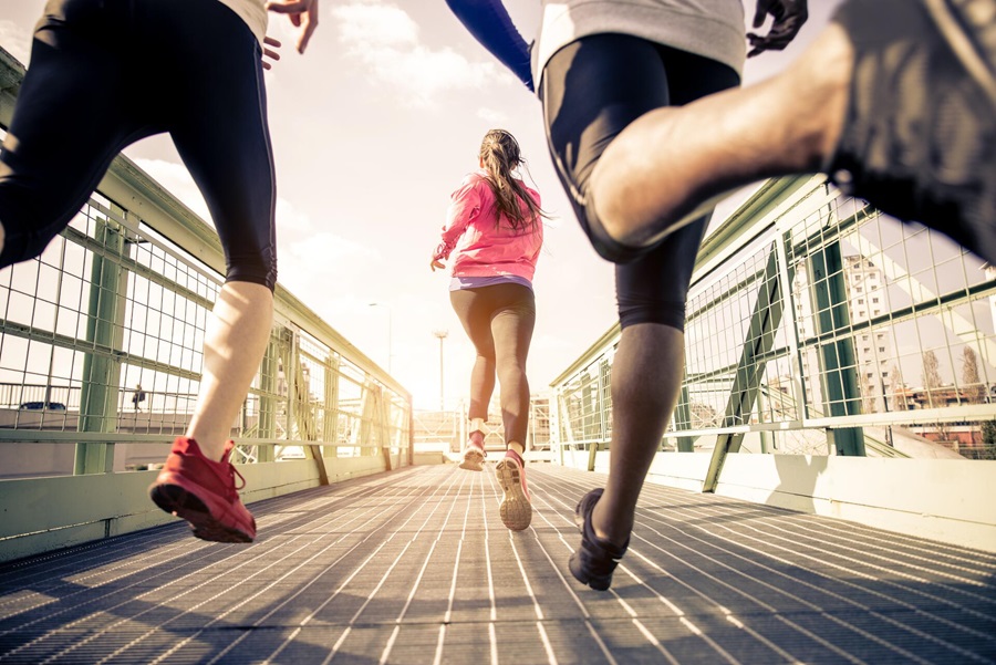 Three runners training in an urban area