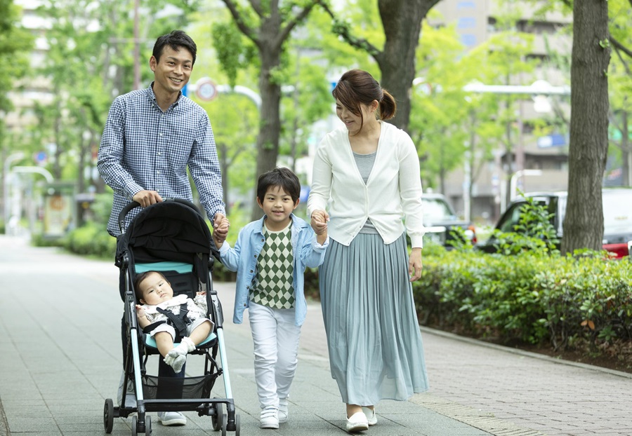 Asian family walking in a city